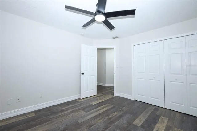a view of a hallway with a wooden cabinets