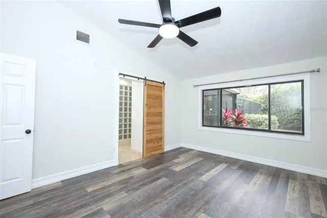 a spacious bathroom with a sink and a mirror