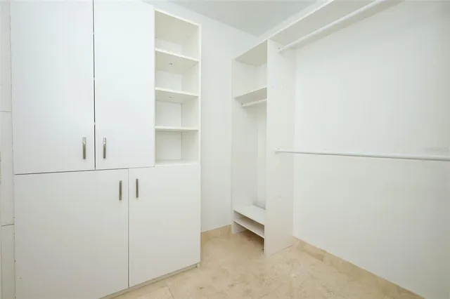 a bathroom with a shower sink and mirror