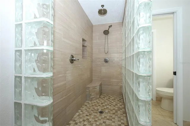 a view of an empty room with a flat screen tv