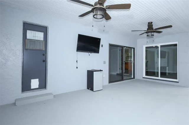 a view of a livingroom with furniture and a flat screen tv