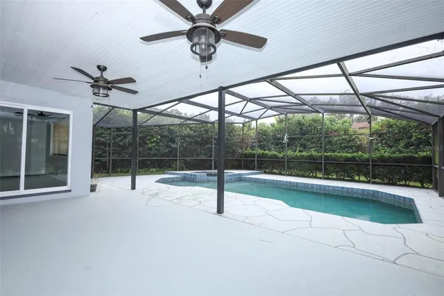 a view of a swimming pool with a yard