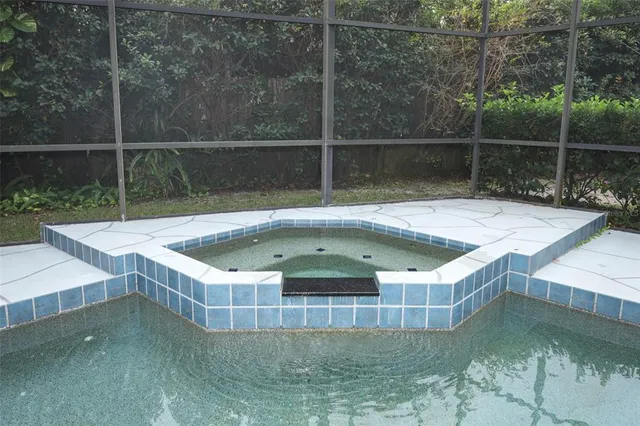 a view of a swimming pool with a patio