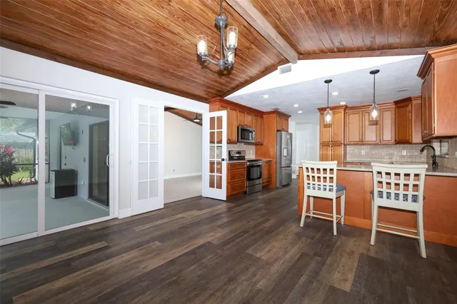 a view of livingroom with furniture wooden floor and chandelier
