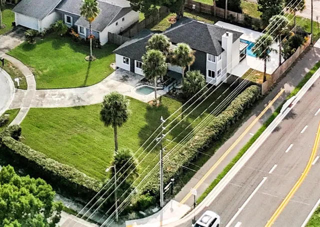 a view of a swimming pool with a yard