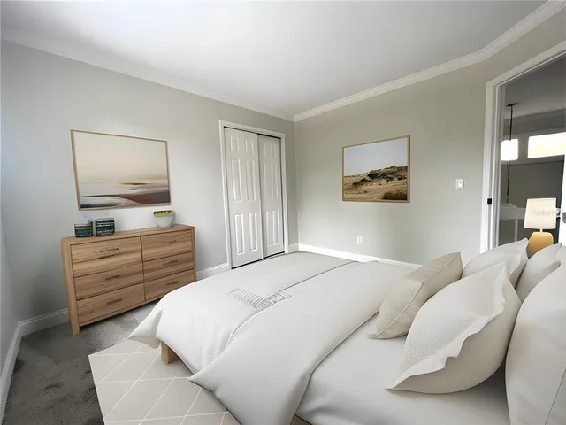 a front view of a house with a yard and trees