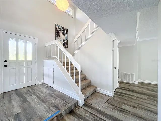 a stove top oven sitting inside of a kitchen