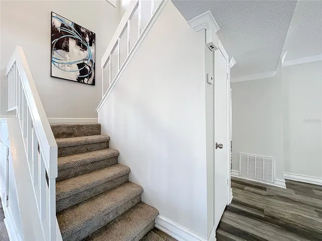a bathroom with a double vanity sink toilet mirror and shower