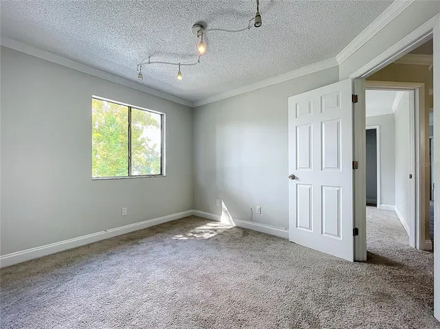 a bathroom with a tub shower and a sink