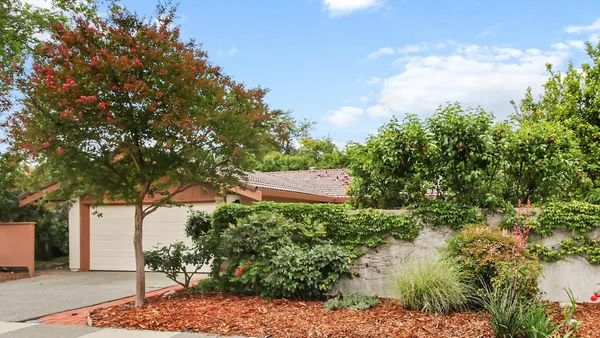 a backyard of a house with lots of green space