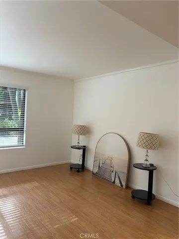 a room with a table chair and a window