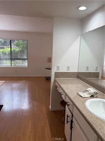 a bathroom with a sink and a large mirror