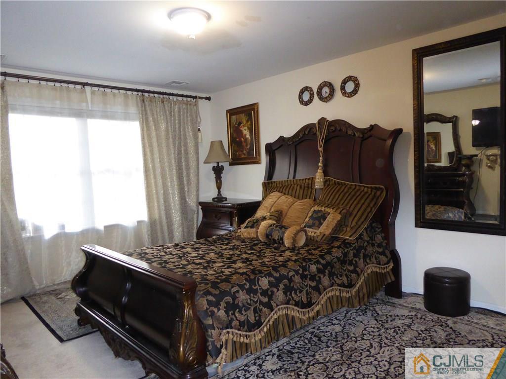 20 Miko Road Edison, NJ 08817 - Photo 12 of 19 a bedroom with a bed and a window