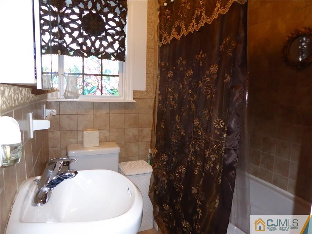 20 Miko Road Edison, NJ 08817 - Photo 13 of 19 a bathroom with a sink and mirror