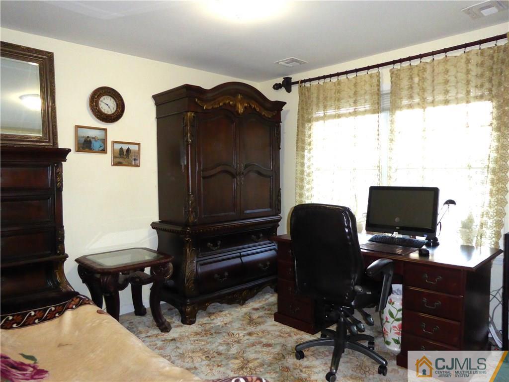 20 Miko Road Edison, NJ 08817 - Photo 15 of 19 a view of workspace with wooden floor windows and piano table