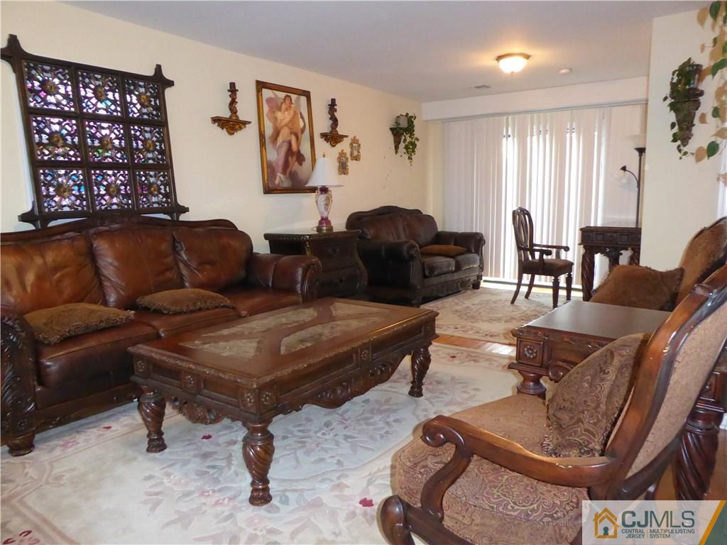 20 Miko Road Edison, NJ 08817 - Photo 4 of 19 a living room with furniture and a large window