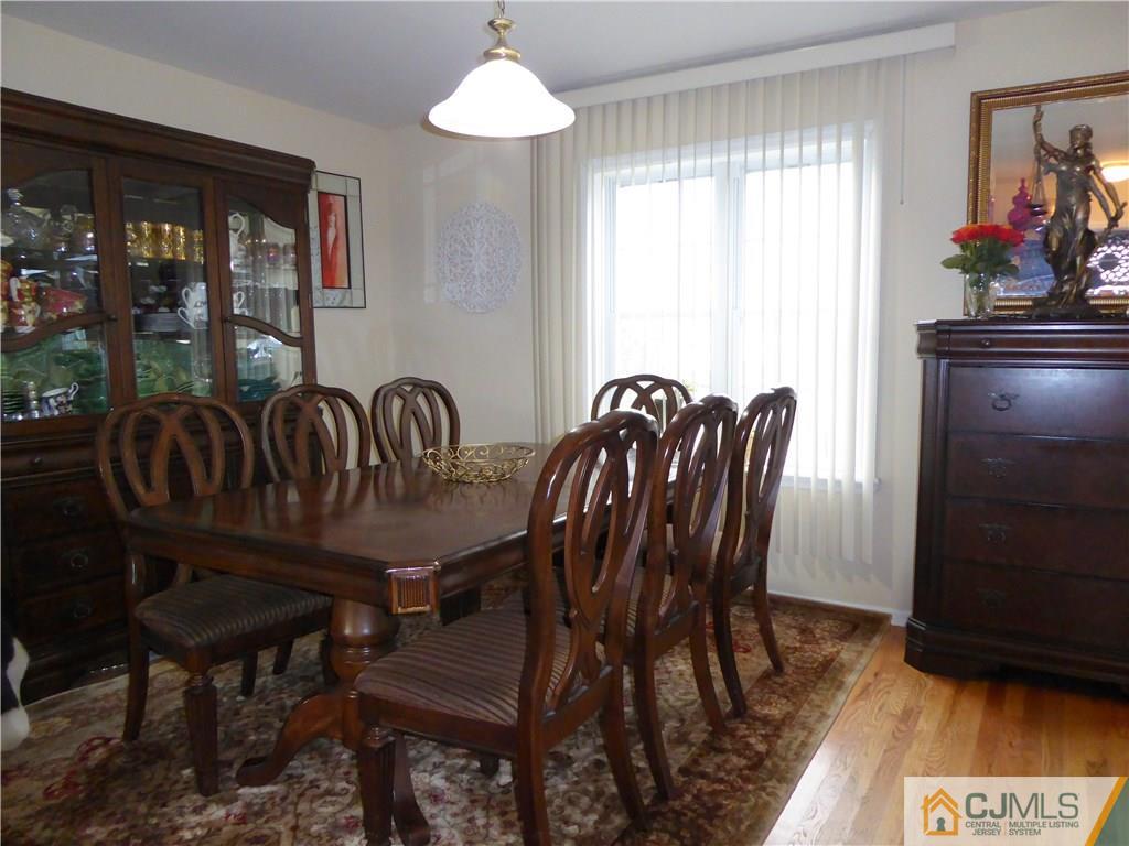20 Miko Road Edison, NJ 08817 - Photo 7 of 19 a view of a dining room with furniture wooden floor and a chandelier