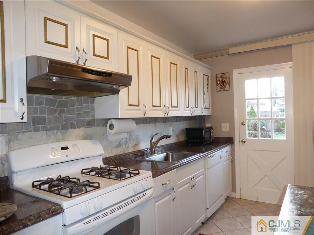 20 Miko Road Edison, NJ 08817 - Photo 8 of 19 a kitchen with stainless steel appliances a stove a sink and cabinets