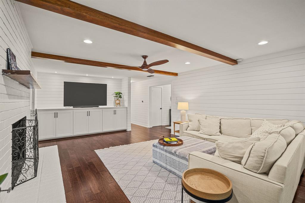 4529 Cloudview Road Fort Worth, TX 76109 - Photo 11 of 26 a living room with furniture and a flat screen tv