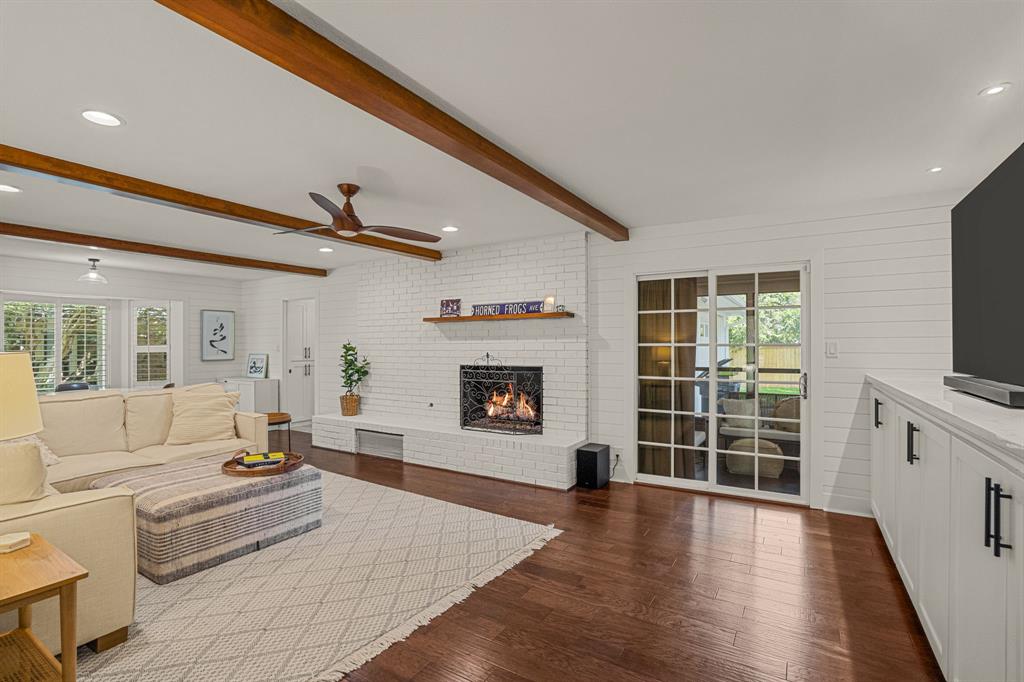 4529 Cloudview Road Fort Worth, TX 76109 - Photo 12 of 26 a living room with furniture wooden floor and a flat screen tv