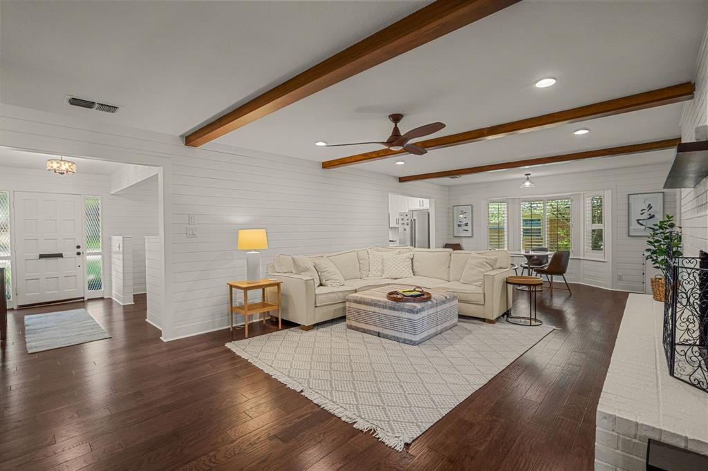 4529 Cloudview Road Fort Worth, TX 76109 - Photo 13 of 26 a living room with furniture and a wooden floor
