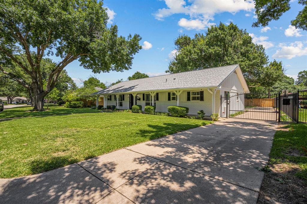 4529 Cloudview Road Fort Worth, TX 76109 - Photo 2 of 26 a view of a white house next to a yard with big trees