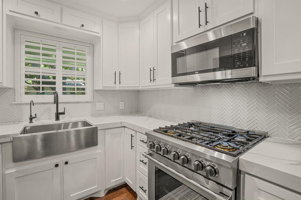 4529 Cloudview Road Fort Worth, TX 76109 - Photo 9 of 26 a kitchen with a stove and a sink