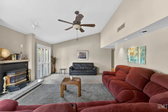 a living room with furniture and a fireplace