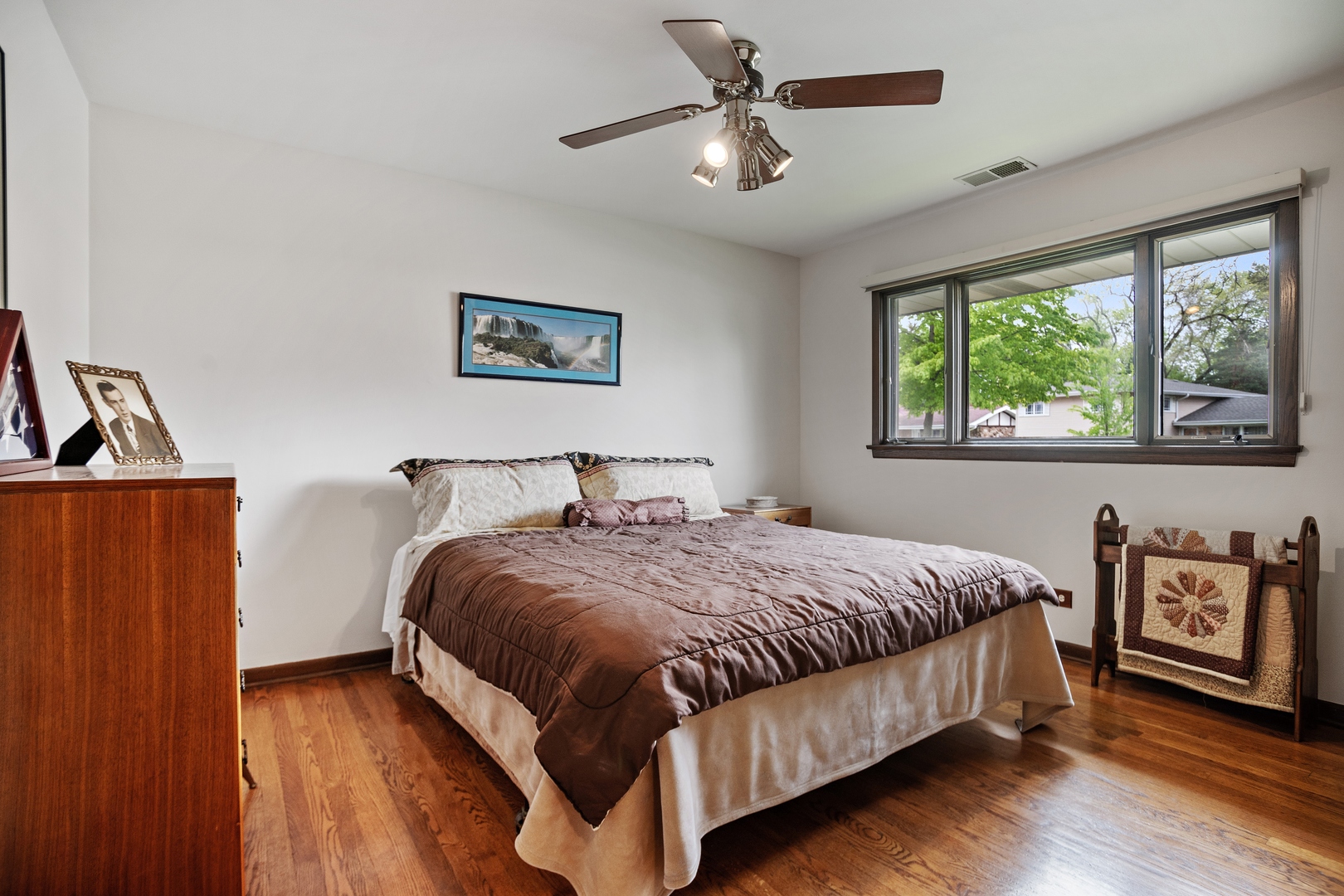 1301 North Dee Road Park Ridge, IL 60068 - Photo 14 of 22 a bedroom with a bed and a large window