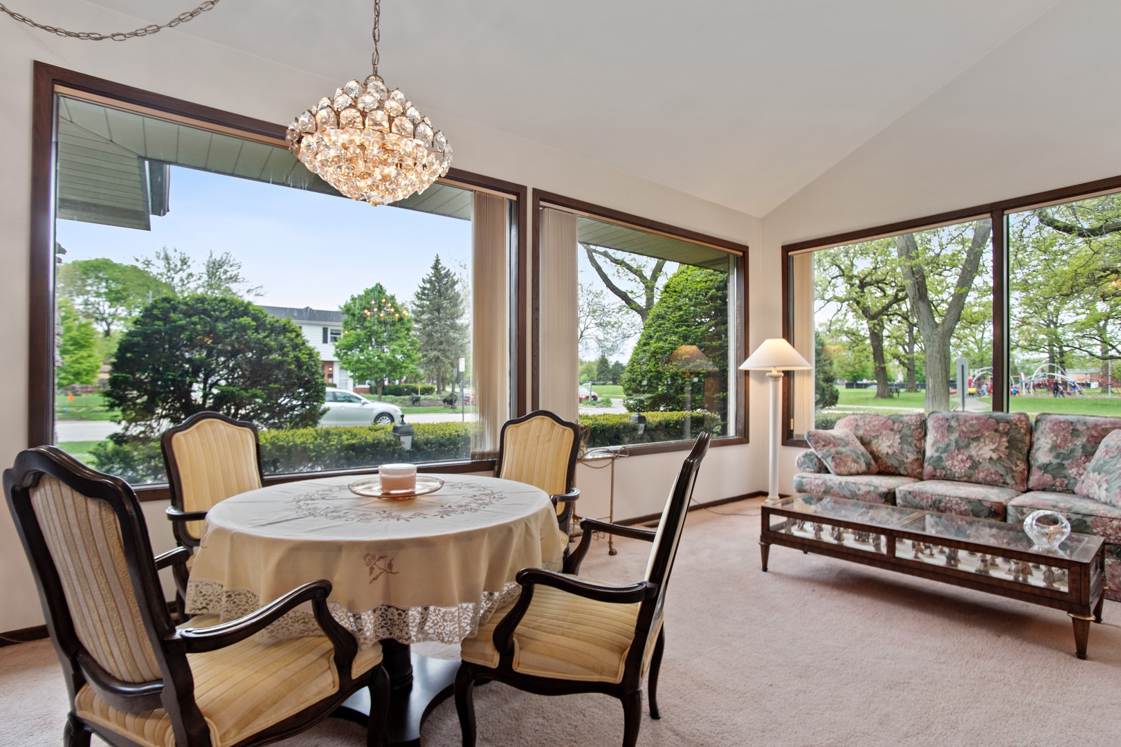 1301 North Dee Road Park Ridge, IL 60068 - Photo 4 of 22 a view of a dining room with furniture a chandelier and large windows