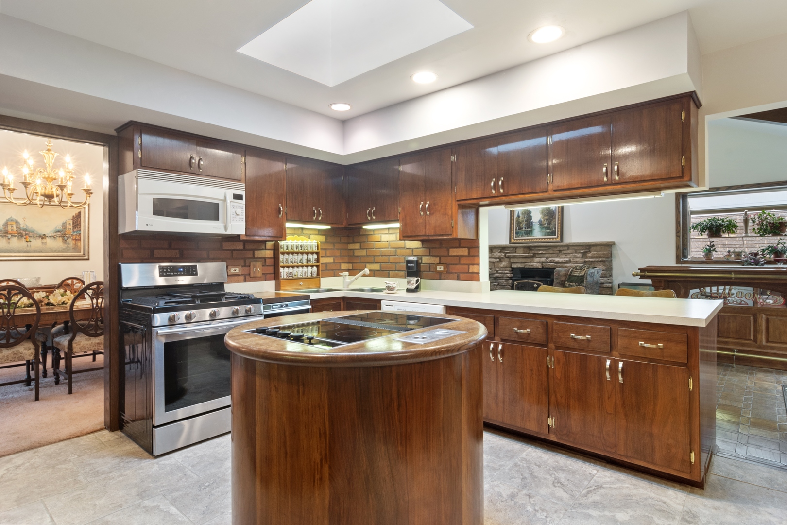 1301 North Dee Road Park Ridge, IL 60068 - Photo 8 of 22 a kitchen with stainless steel appliances granite countertop a stove a sink and a refrigerator