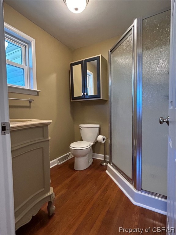 1489 Laurens Road Gloucester Point, VA 23062 - Photo 26 of 43 Master Bathroom featuring wood-type flooring, vanity, toilet, and walk in shower