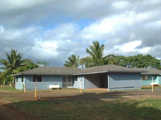 4855 Nonou Road, Unit 1 Kapaa, HI 96746 - Photo 1 of 4 a front view of a house with a yard and garage