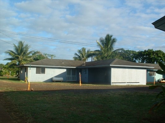 4855 Nonou Road, Unit 1 Kapaa, HI 96746 - Photo 2 of 4 a front view of a house with a yard and garage