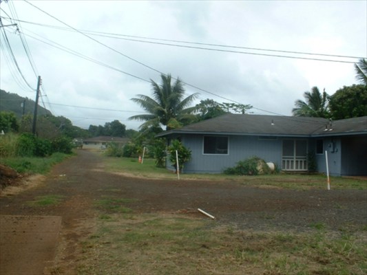4855 Nonou Road, Unit 1 Kapaa, HI 96746 - Photo 3 of 4 a front view of a house with a yard and garage