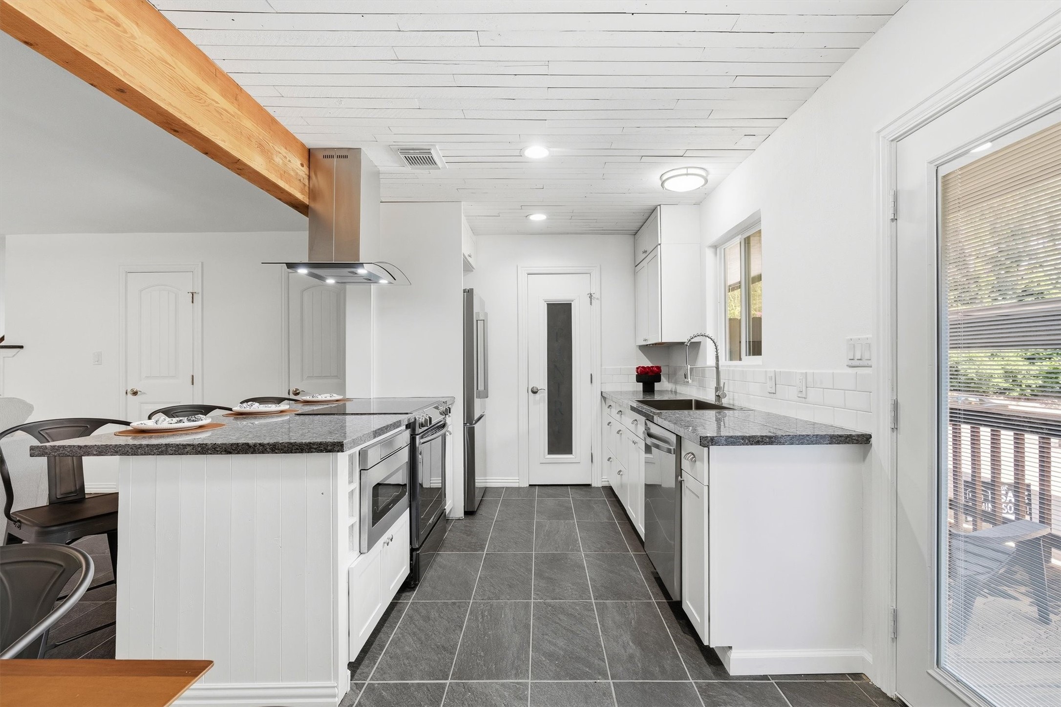 1011 Hamblen Road, Unit 306 Houston, TX 77339 - Photo 10 of 38 Sleek cabinetry lines this side of the kitchen, giving you plenty of room to keep everything organized and within easy reach.