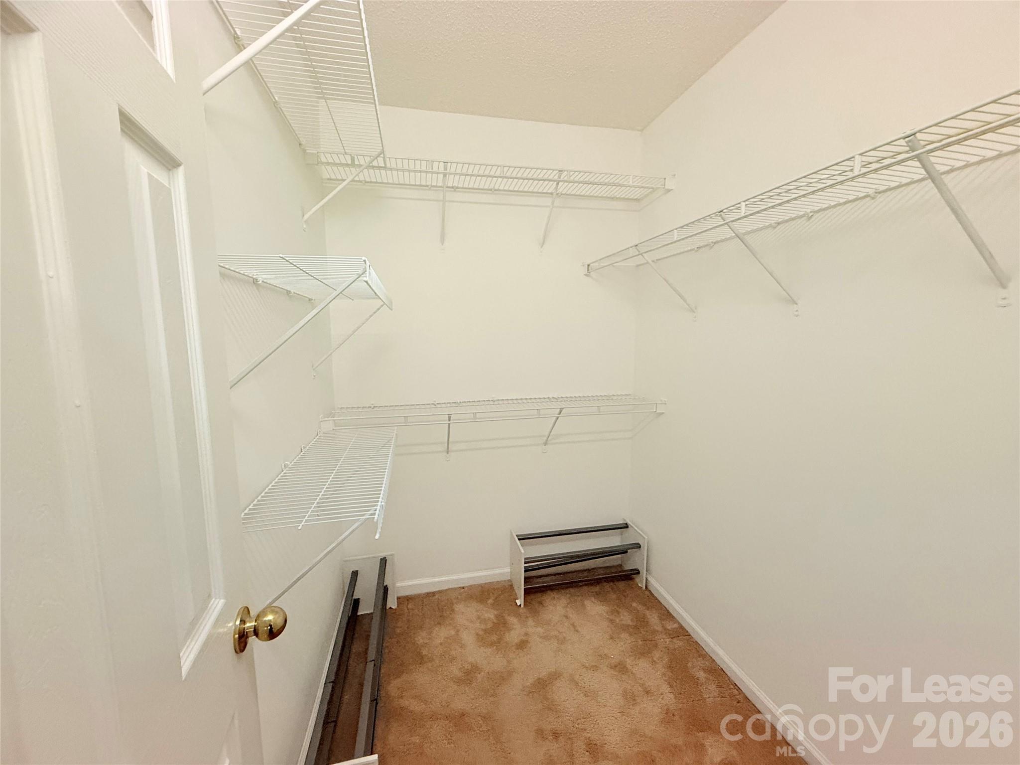 10553 Gold Pan Road Charlotte, NC 28215 - Photo 12 of 15 a view of a room with racks on the wall