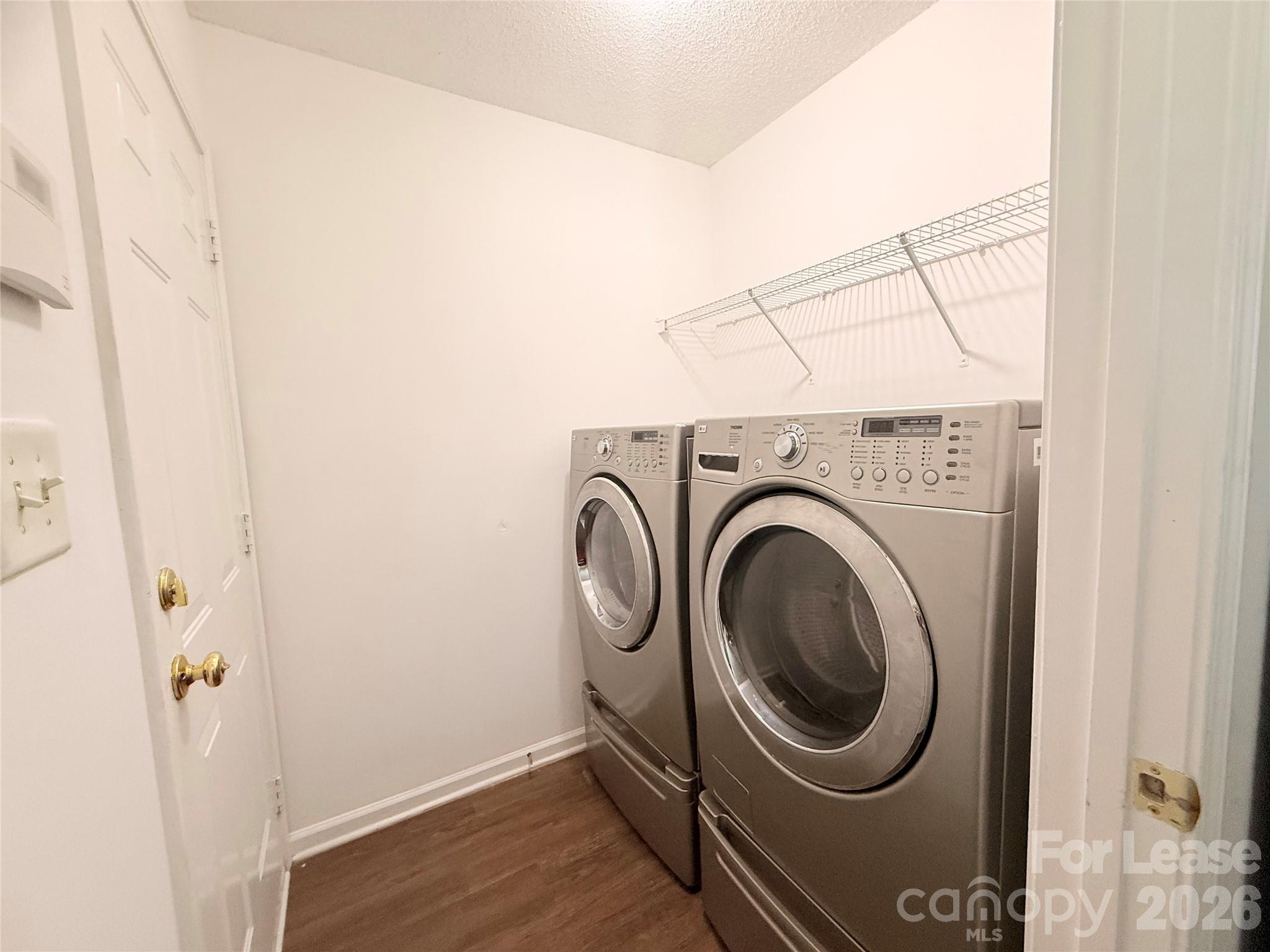 10553 Gold Pan Road Charlotte, NC 28215 - Photo 13 of 15 a utility room with dryer and washer