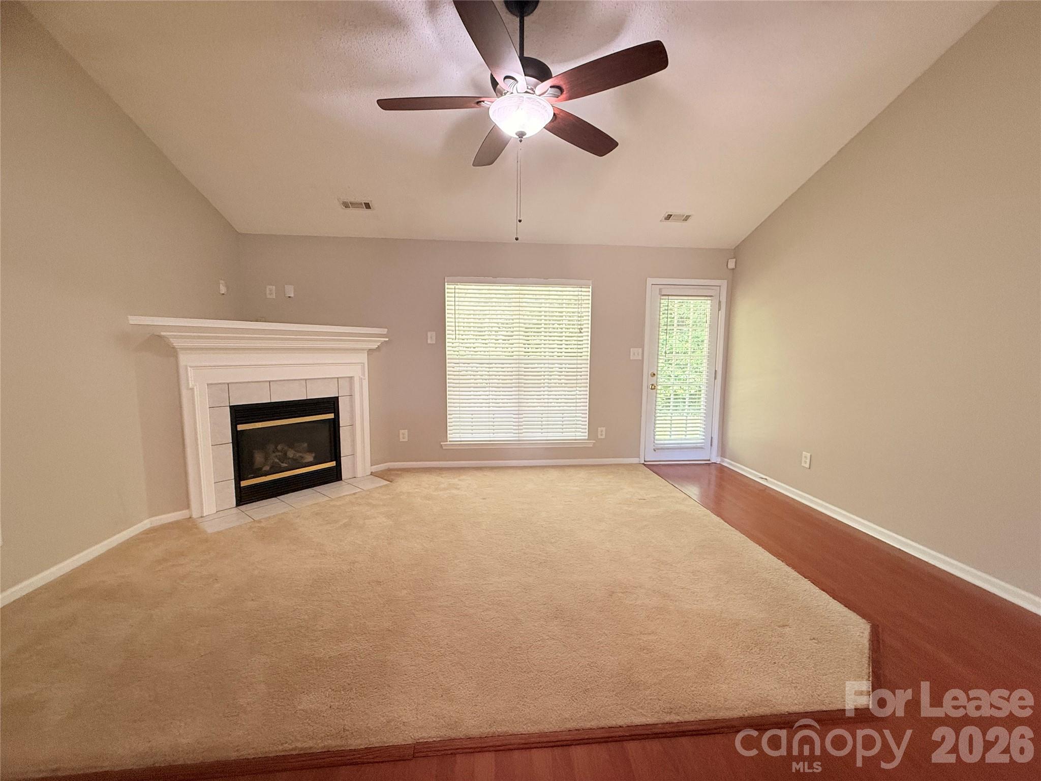 10553 Gold Pan Road Charlotte, NC 28215 - Photo 3 of 15 a view of empty room with a fireplace