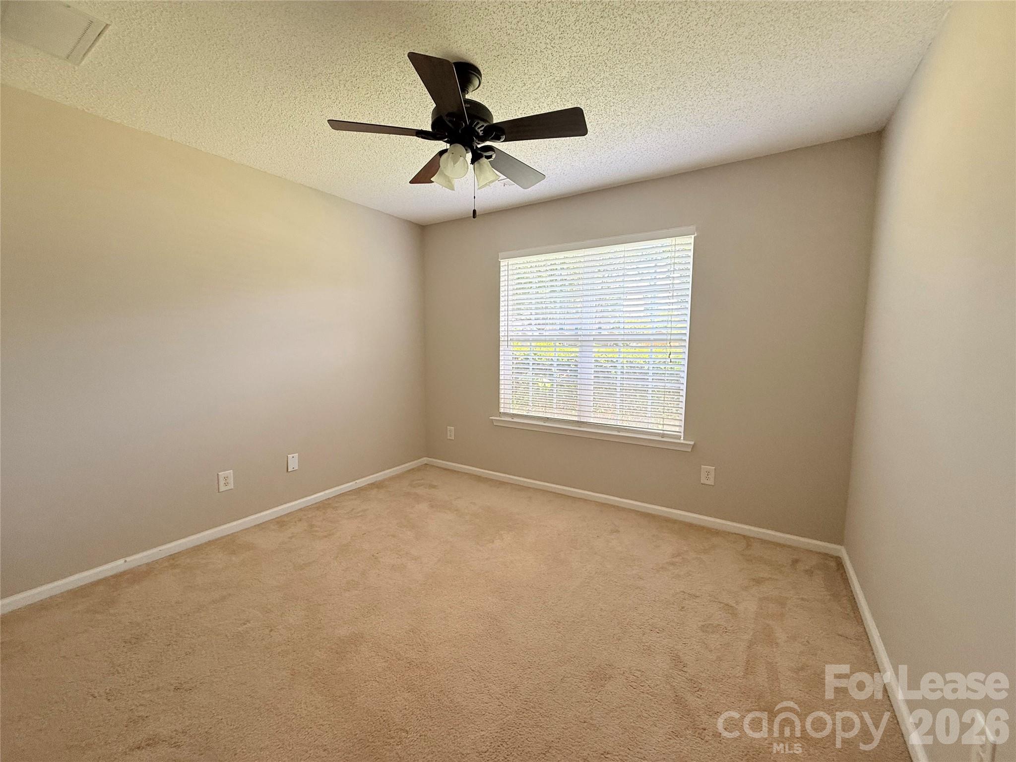 10553 Gold Pan Road Charlotte, NC 28215 - Photo 6 of 15 a view of an empty room with a window
