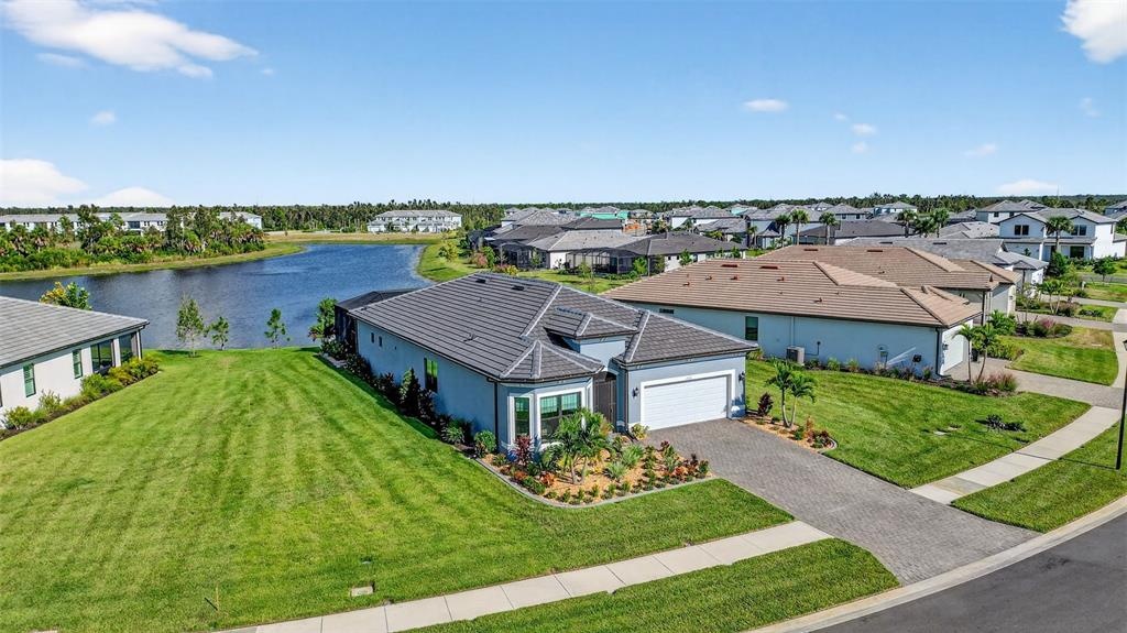 17312 Luminous Avenue Venice, FL 34293 - Photo 1 of 1 an aerial view of a house with a garden