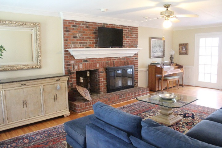 2205 Millpine Drive Raleigh, NC 27614 - Photo 5 of 22 25'x14' Front to Back Family Room has hardwood floors. Masonry Wood Burning fireplace with firewood box. Crown moldings, chair-rails and wainscoting. Family Room