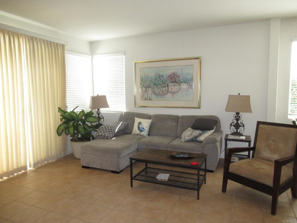 6033 Patmos Way Oceanside, CA 92056 - Photo 13 of 41 a living room with furniture and a large window
