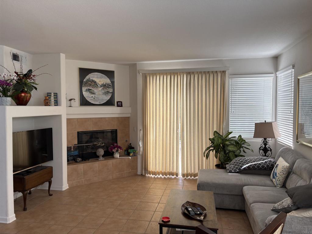 6033 Patmos Way Oceanside, CA 92056 - Photo 14 of 41 a living room with furniture and a fireplace