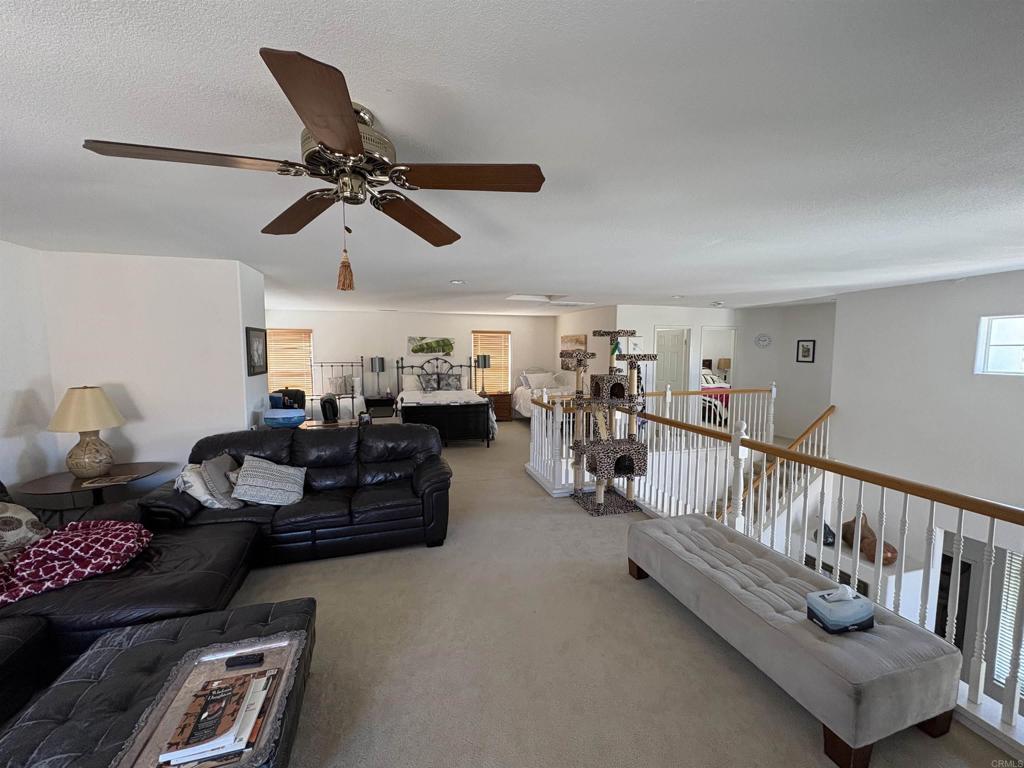 6033 Patmos Way Oceanside, CA 92056 - Photo 24 of 41 a living room with furniture and a ceiling fan