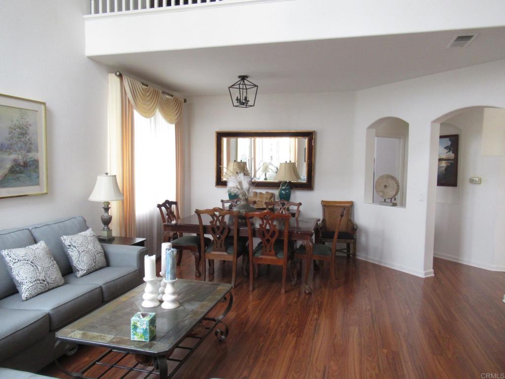 6033 Patmos Way Oceanside, CA 92056 - Photo 8 of 41 a living room with furniture dining table and a window