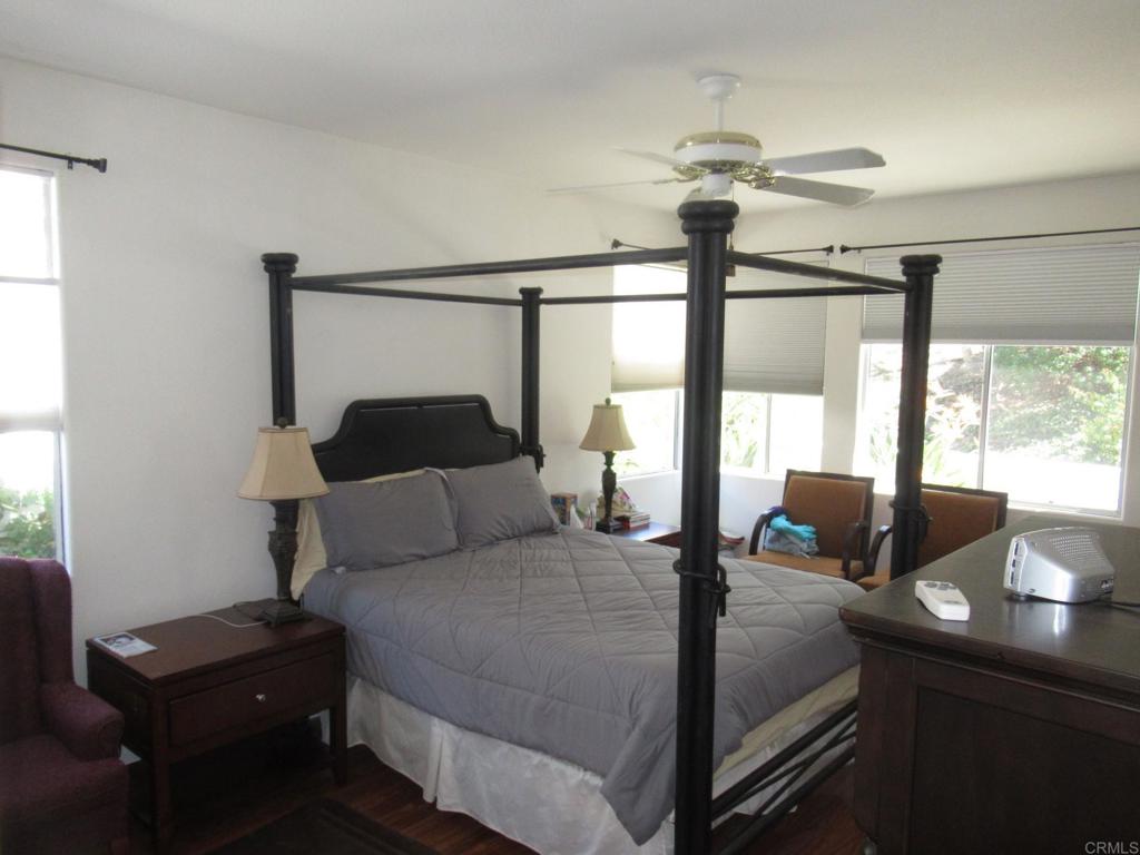 6033 Patmos Way Oceanside, CA 92056 - Photo 10 of 41 a bedroom with a bed and a window