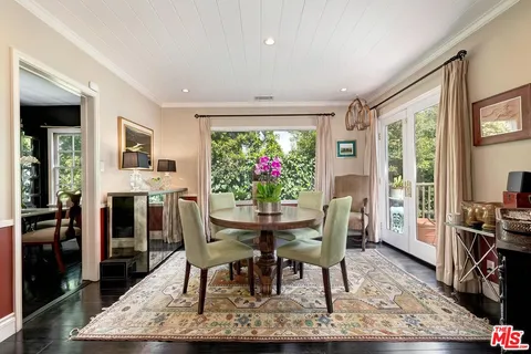 a view of a chair and tables in the balcony