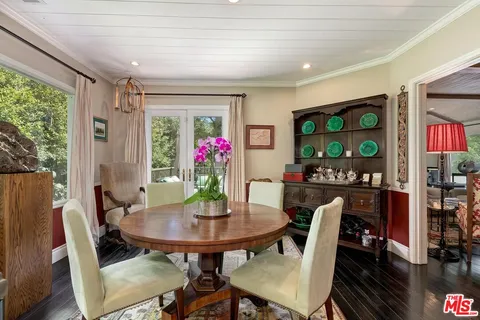 a view of a chairs and table in the patio