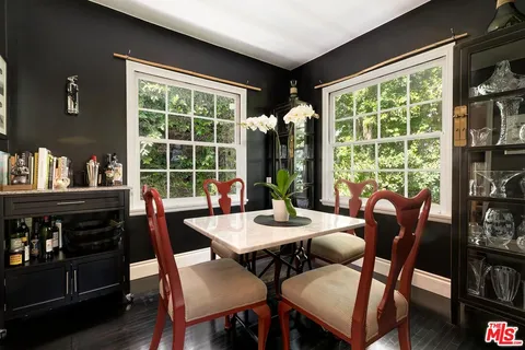 a kitchen with kitchen island granite countertop a sink appliances cabinets and counter space